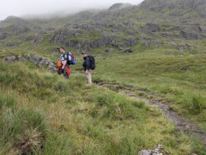 Tired hikers, walking from Glenfinnan to Inverie. Climbing bastard hill