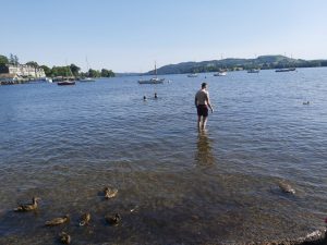 Standing in Windermere lake at Borrans Park in Ambleside